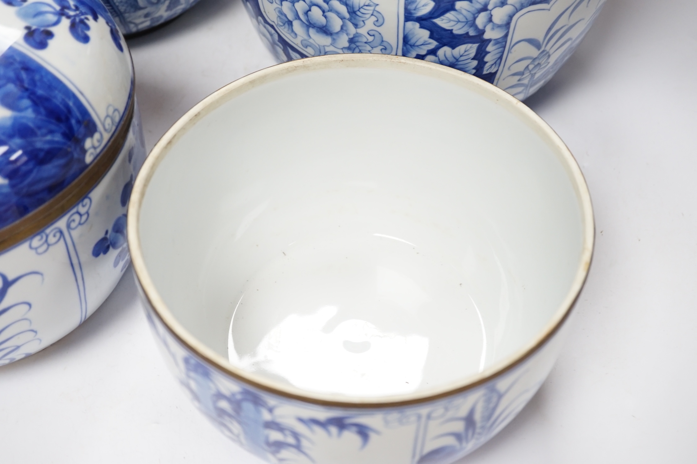 Two pairs of Japanese Arita blue and white bowls and covers, largest 27cm